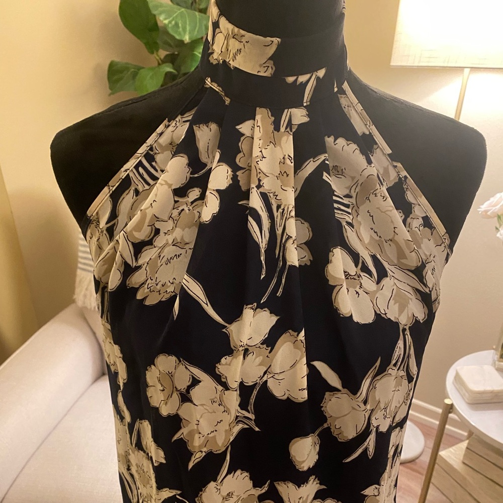 Blue and beige sleeveless collared blouse with floral print. Size XS.